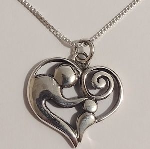 STERLING SILVER MOTHER AND CHILD PENDANT WITH CHAIN.